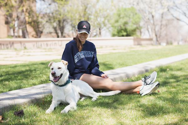 UNC Student with her pet dog